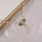 Collar con colgante de doble cisne morado